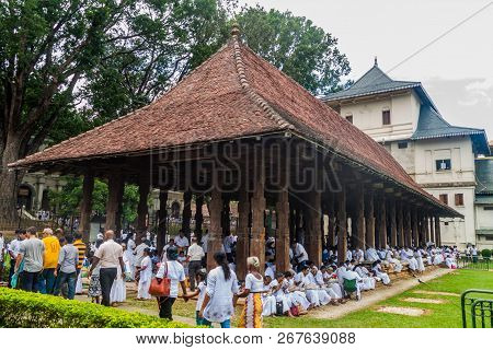 Kandy, Sri Lanka - July 19, 2016: White Clothed Buddhist Devotees At The Grounds Of The Temple Of Sa