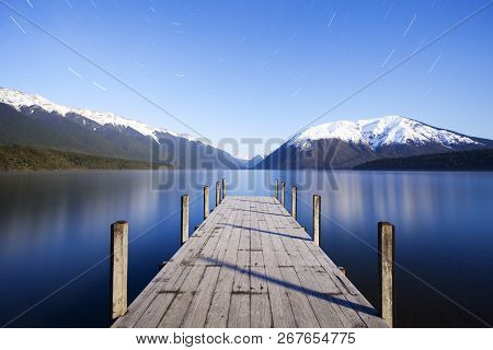 The Jetty At Lake Rotoiti, Nelson Lakes National Park, New Zealand, By Moonlight. Star Trails Can Be