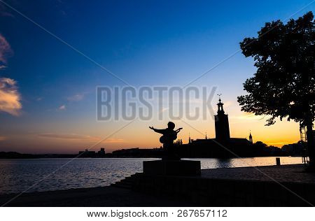 Silhouette Of Evert Taube Statue Monument And Stockholm City Hall (stadshuset) Building Municipal Co