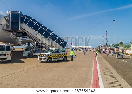 Hulhule Island, Maldives - July 11, 2016: Passengers Leave An Airplane At Ibrahim Nasir Internationa