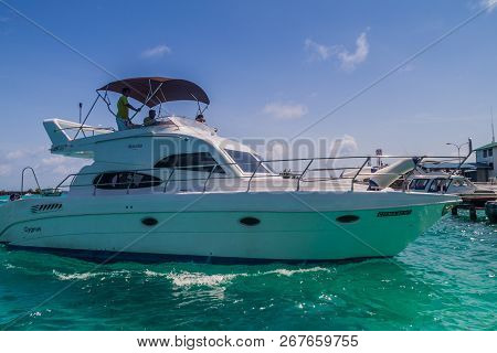 Hulhule Island, Maldives - July 11, 2016: Yacht At The Harbor Next To Ibrahim Nasir International Ai