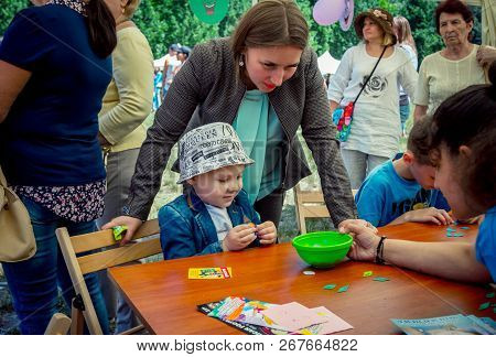 Zaporozhia/ukraine- June 2, 2018:charity Family Festival - Small Girl And Her Mother Participating A
