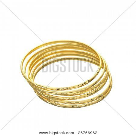 4 つの金のブレスレットを一緒に積層。