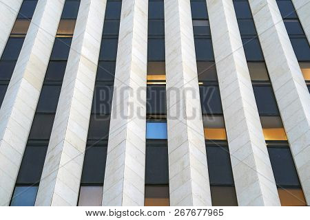 Bottom View Glass Grey Square Windows Of Modern City Business Building Skyscraper. Receding Perspect