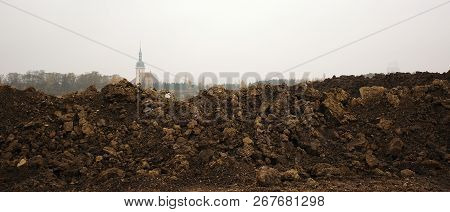 Most, Czech Republic - November 04, 2018: Clay Hill Near Most City With Kostel Nanebevzeti Panny Mar