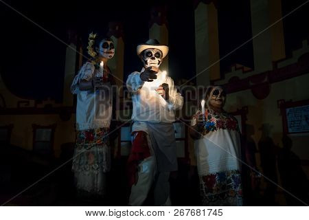 Merida, Cementerio General, Mexico - 31 October 2018: Customed Man With Candles And Pointing And Two