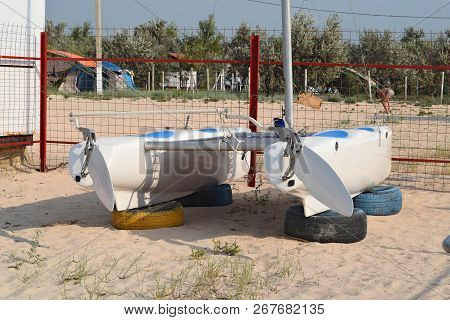 Catamaran On The Beach. The Boat, Driven By Pedals.