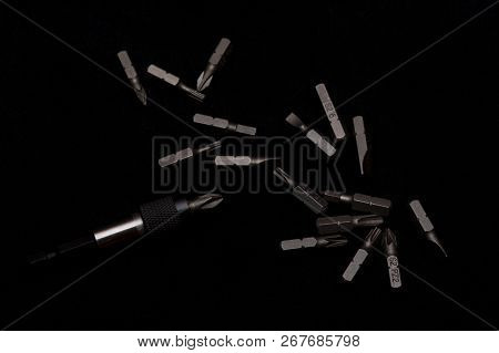 Tool Carbon Steel Bits With Bit Holder On Black Background In Dark Key Style.