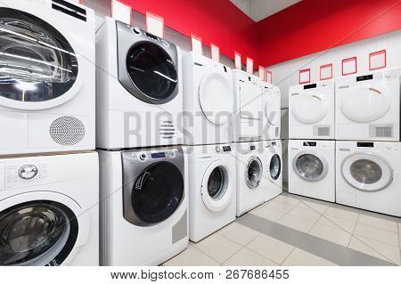 Row of washing mashines in appliance store