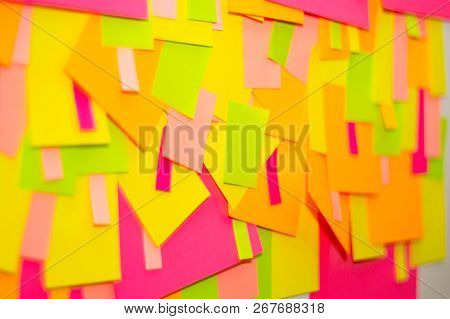 Bright Multi-colored Stickers On The Office White Board.