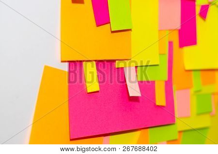 Bright Multi-colored Stickers On The Office White Board.