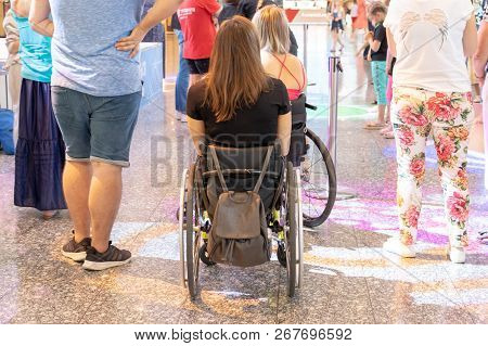 Moscow, Russia - August 29, 2018: Two Disabled Persons In Wheelchairs In The Shopping Mall.