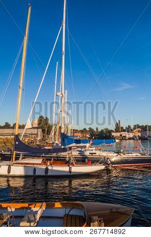 Sail Boats In A Harbor At Suomenlinna Sveaborg , Sea Fortress Near Helsinki, Finland