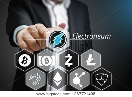 Business Man Points His Finger At Electroneum Coin Icon Among Others Cryptocurrency On Virtual Touch