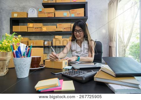 Young Asian Teenager Owner Business Woman Work At Home For Online Shopping, Writing The Order And Pr