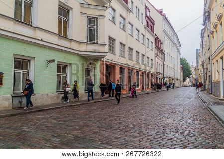 Tallinn, Estonia - August 22, 2016: People Walk Along Cobbled Pikk Street In The Old Town Of Tallinn