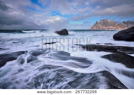 Rocky coast of fjord of Norwegian sea in winter. Lofoten islands, Norway
