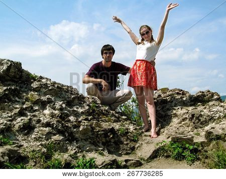 A Pair Of Young People Enjoy Life On The Ruins Of The Medieval Khust Castle In Transcarpathia, Ukrai