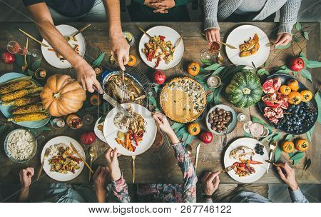 Friends Or Family Eating Nacks At Christmas Table