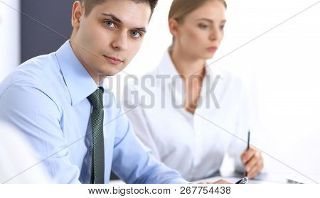 Group Of Business People Or Lawyers Discussing  Terms Of Transaction In Office. Colleagues Working A