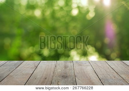 Old Wooden Table Foreground With Blurred Green Bokeh Background, Empty Space Place A Product. Nature