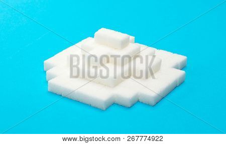 Pile Of Sugar Cubes, Isolated On Blue