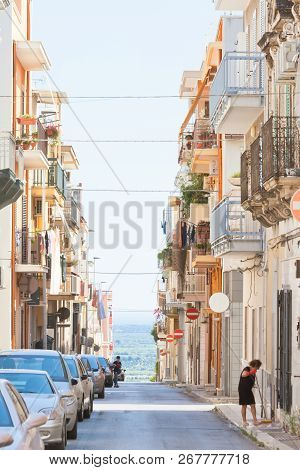 Massafra, Apulia, Italy - May 31, 2017 - Cars And Native People In The Streets Of Massafra