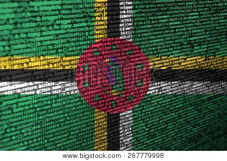 Dominica Flag  Is Depicted On The Screen With The Program Code. The Concept Of Modern Technology And