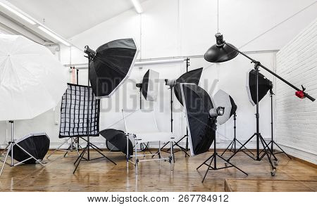 Professional Photo Studio With Lighting Equipment; Light Stands, Softbox, Studio Flash, Umbrellas.