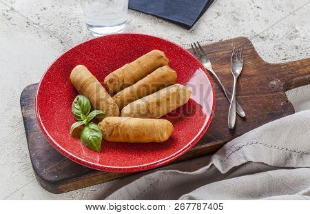 Latin-american Appetizers Called Tequenos Made Of Fried Corn Filled With Cheese.