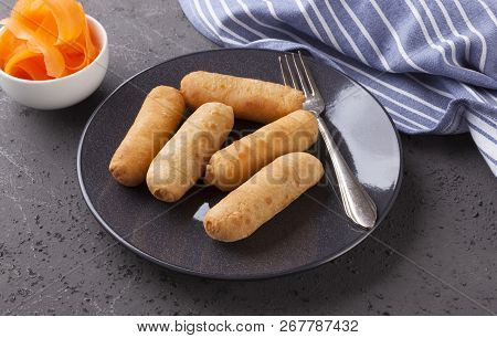 Latin-american Appetizers Called Tequenos Made Of Fried Corn Filled With Cheese.