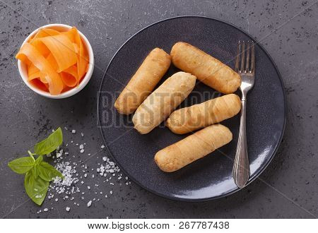 Latin-american Appetizers Called Tequenos Made Of Fried Corn Filled With Cheese.