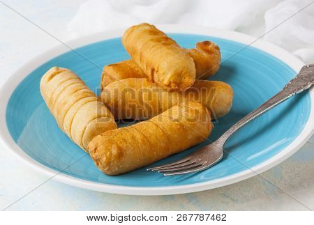 Latin-american Appetizers Called Tequenos Made Of Fried Corn Filled With Cheese.