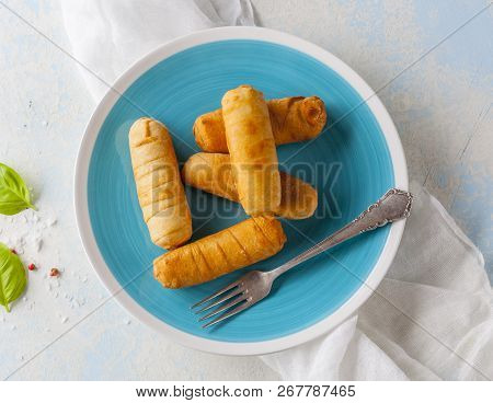 Latin-american Appetizers Called Tequenos Made Of Fried Corn Filled With Cheese.