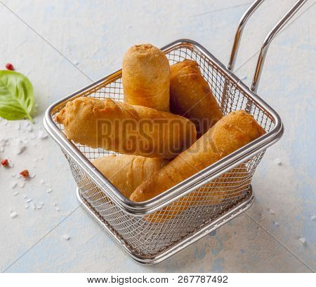 Latin-american Appetizers Called Tequenos Made Of Fried Corn Filled With Cheese.