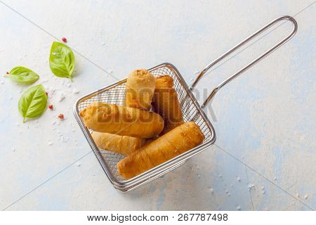 Latin-american Appetizers Called Tequenos Made Of Fried Corn Filled With Cheese.