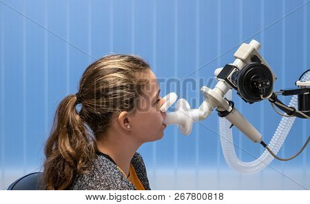 A Young Girl Having A Lung Function Test