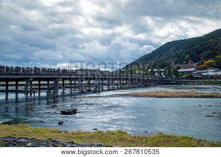 Togetsukyo Bridge In Arashiyama, Kyoto Prefecture, Japan During Koyo Vibrant Autumn Foliage Festival