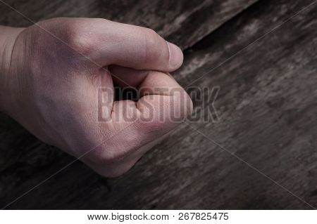 Male Fist Banged On A Wooden Table
