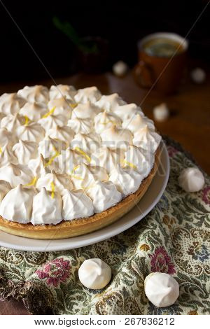 Lemon Meringue Cake Served With Tea On A Dark Background. Rustic Style.