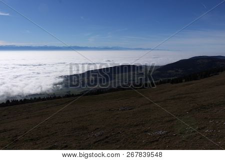 The France Alps With Lots Of Low Clouds And Fog