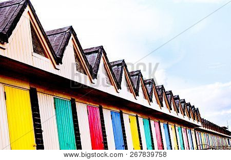 Colourful Rows  Of  Beach Huts English Seaside