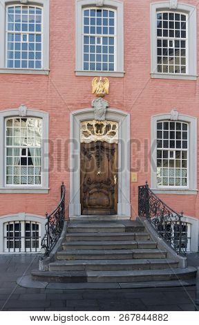 Facade And Steps Of A Salmon Coloured House In The Historic Town Of Monschau, Aachen, Germany