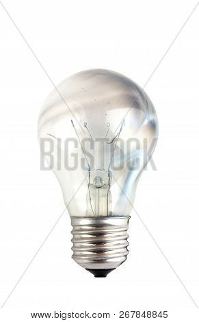 Burnt Light Bulb On A White Background. One Burnt Out Light Bulb Close Up On A White Background.