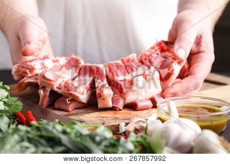 Close-up Cutting Fresh Meat For Cooking Meat Dishes
