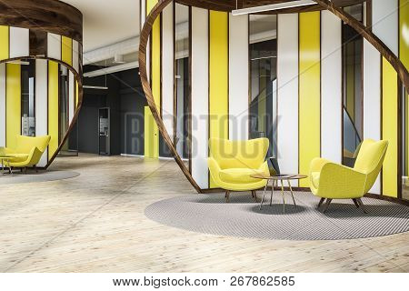 Modern Office Waiting Area With Gray Walls, Wooden Floor, Yellow Door And Yellow Armchairs Standing 