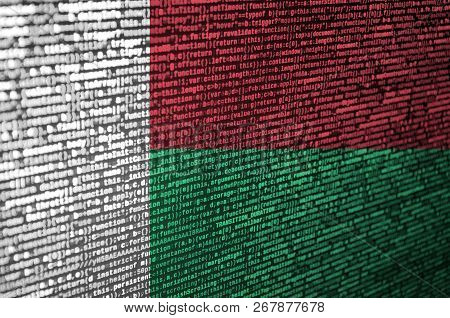 Madagascar Flag  Is Depicted On The Screen With The Program Code. The Concept Of Modern Technology A