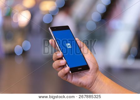 Chiang Mai, Thailand - Oct. 28,2018: Man Holding Huawei Mobile Phone With Linkedin Application On Th