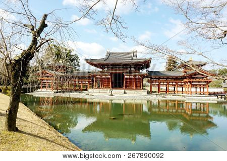 Byodoin Japanese Buddhist Temple Hall On Bright Blue Sky With Clouds. Byodoin Temple Is The One Of S