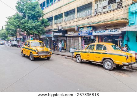 Kolkata, India - October 27, 2016: View Of Yellow Hindustan Ambassador Taxis In The Center Of Kolkat